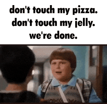 a boy with a bandage on his arm is talking to another boy in a hallway while holding a pizza ..