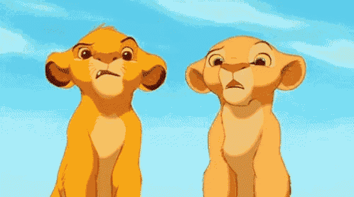 simba and nala from the lion king are sitting next to each other and looking up .