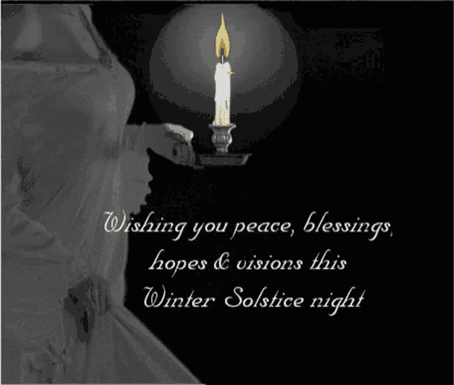 a black and white photo of a woman holding a lit candle with the words wishing you peace blessings