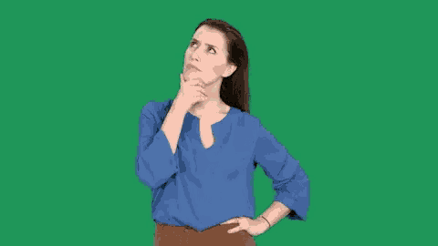 a woman in a blue shirt and brown pants is thinking and looking up .