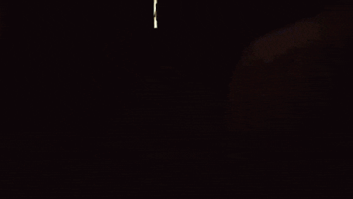 a man in a white shirt is walking through a doorway with a sign that says bank on it