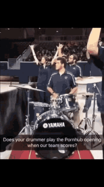 a man playing drums with a yamaha drum set