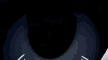 a close up of a person 's eye with a tear coming out of it