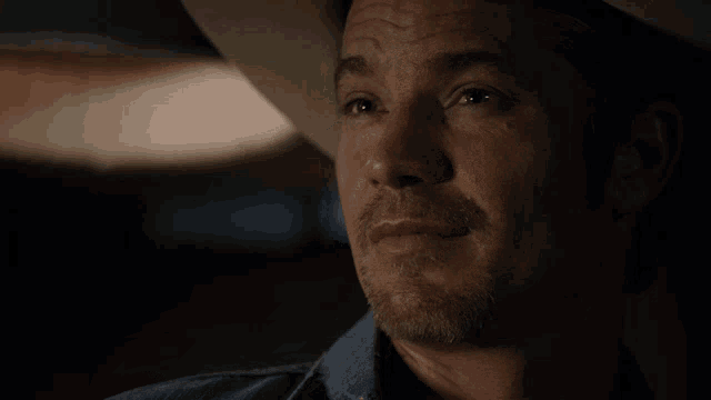 a man in a cowboy hat with the words i tremble with anticipation