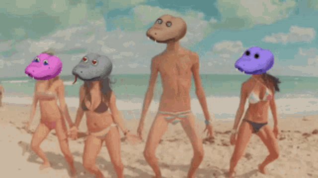 a group of people dancing on a beach with a man wearing a snake head