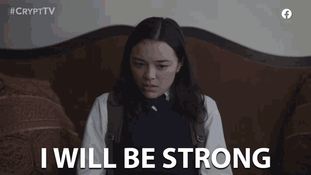a girl sitting on a couch with the words i will be strong behind her