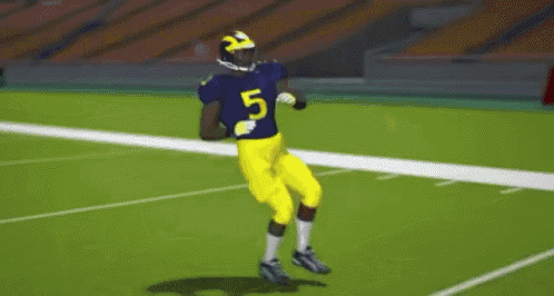 a football player in yellow pants and a helmet is standing on a field .