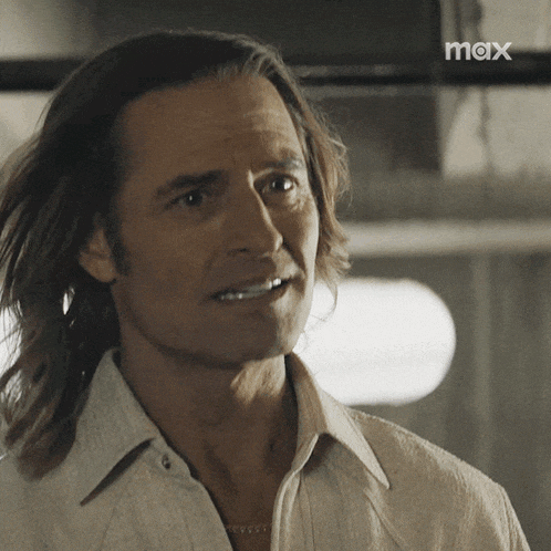 a close up of a man 's face with the word max in the corner
