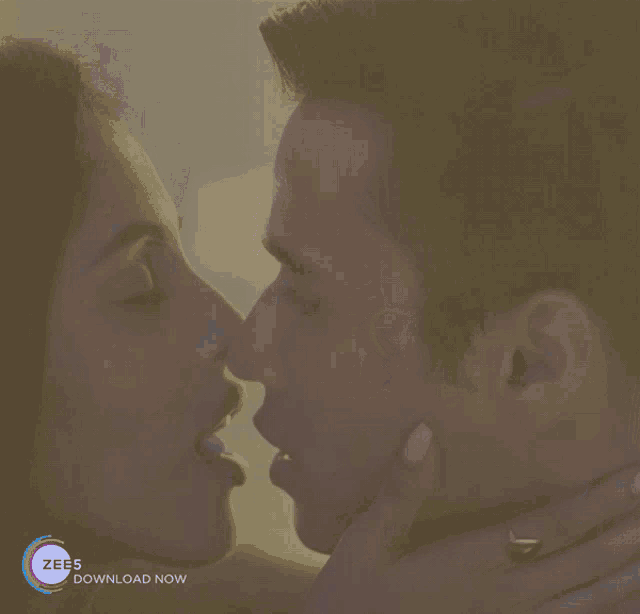 a blurred image of a man and woman kissing with the words zees download now on the bottom