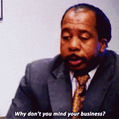 a man in a suit and tie is saying " why don 't you mind your business "