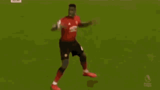a soccer player is dancing on the field during a soccer game .