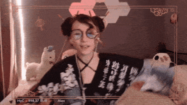 a girl wearing glasses and a shirt that says alex