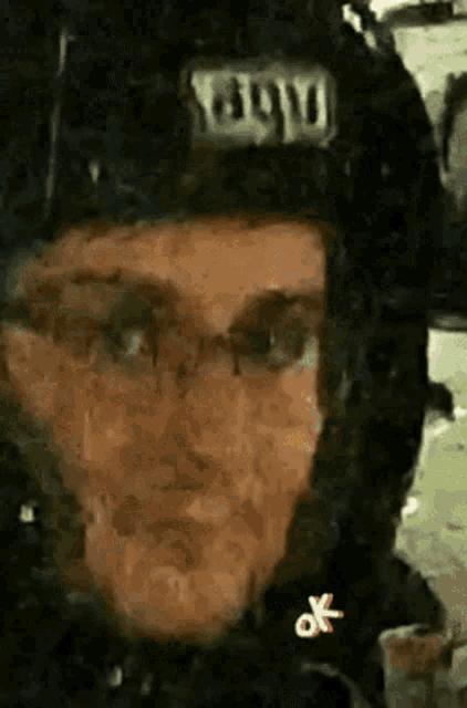 a close up of a person wearing a helmet that has the word boy on it