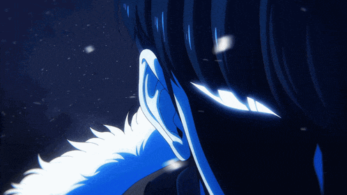 a close up of a person 's ear with a blue background