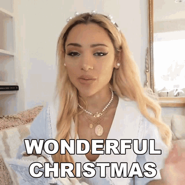 a woman says wonderful christmas while wearing a headband