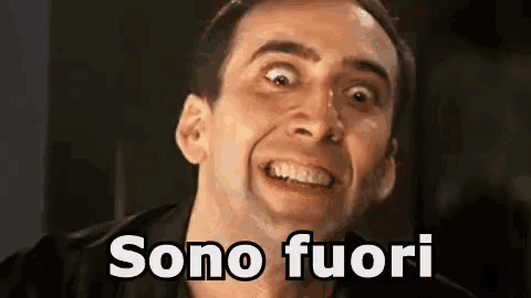 a man is making a funny face with the words sono fuori written above him .