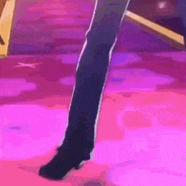 a close up of a person 's leg on a pink carpet