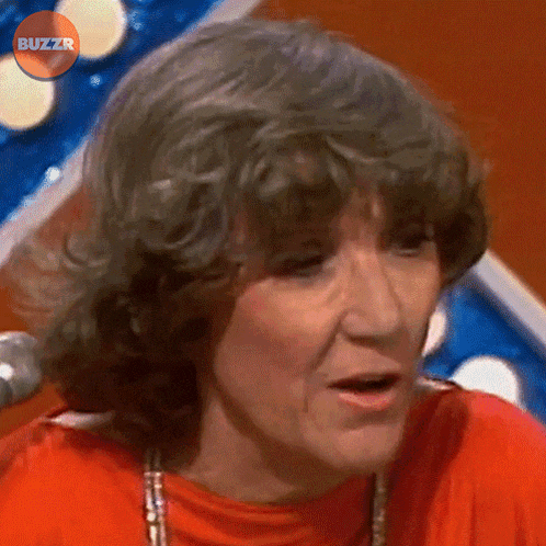 a close up of a woman 's face with buzzr written in the corner