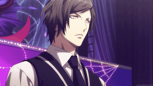 a man in a vest and tie stands in front of a purple background