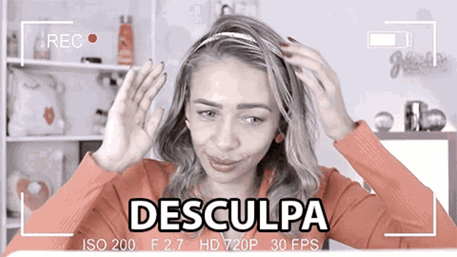 a woman is being recorded with the words desculpa on the bottom right