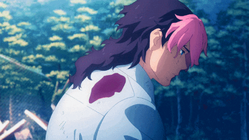 a man with pink hair and purple hair has a bloody spot on his back
