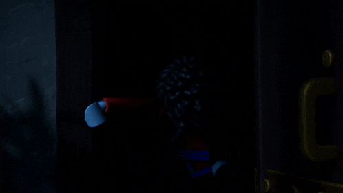 a blue lego figure with a red cape is laying down with his mouth open