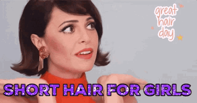 a woman with short hair is wearing a red shirt and earrings