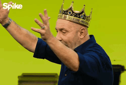 a man wearing a crown with spike written on the bottom