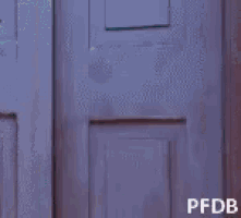 a person peeking out of a door with pfdb written on the bottom right