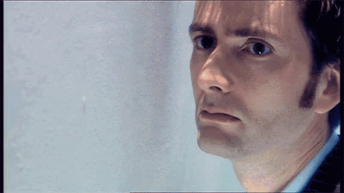 a close up of a man 's face with a serious expression