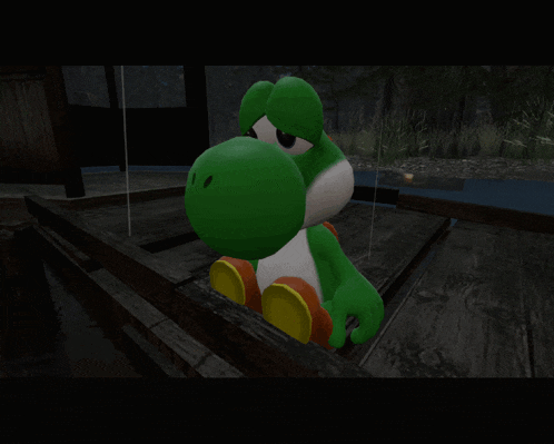 a green and white yoshi toy is sitting on a wooden deck