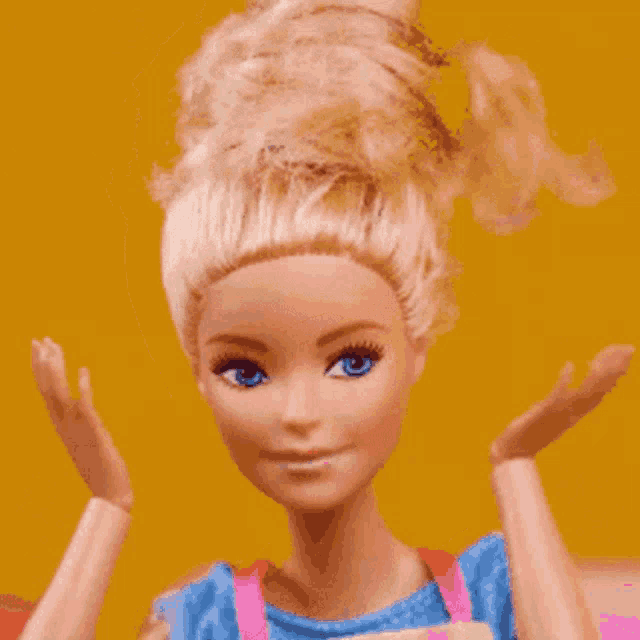 a close up of a barbie doll 's face and hands