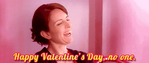 a woman is laughing and says happy valentine 's day no one