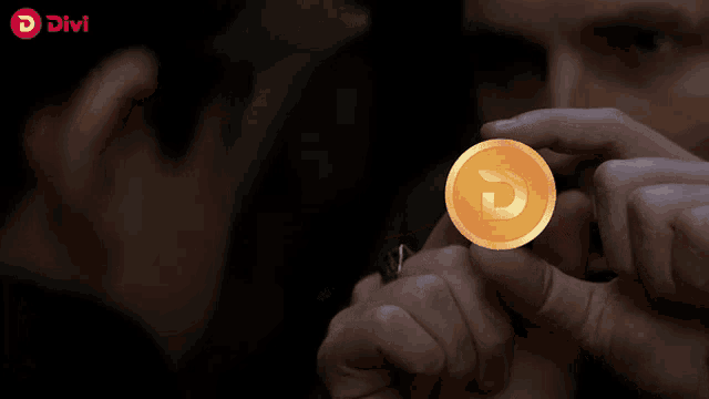 a person is holding a coin in their hand with a divvi logo in the background