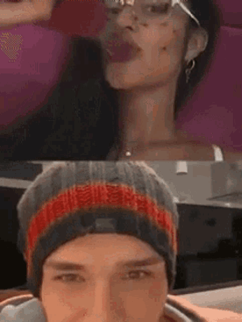 a man and a woman are sitting next to each other and the man is wearing a beanie .