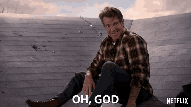 a man in a plaid shirt sits on a ledge with the words oh god written below him