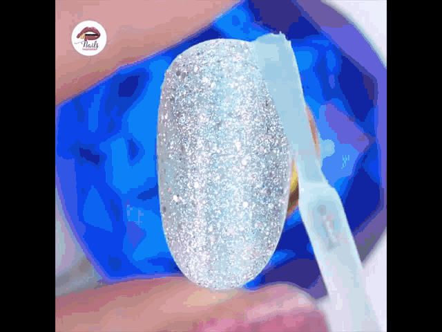 a close up of a woman 's nails with the word nails visible