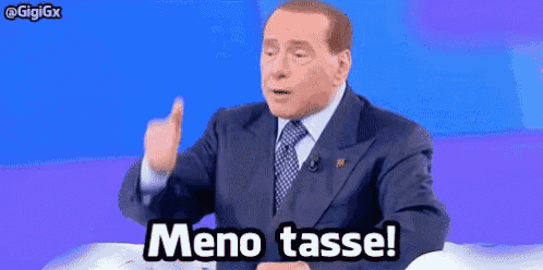 a man in a suit and tie is giving the middle finger and says meno tasse