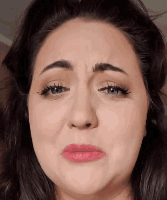 a close up of a woman making a funny face