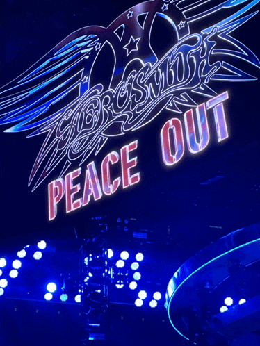 a sign that says peace out is lit up in neon
