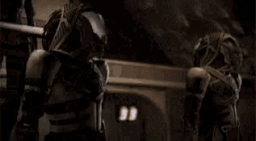 a close up of a person wearing a helmet and holding a gun in a video game .