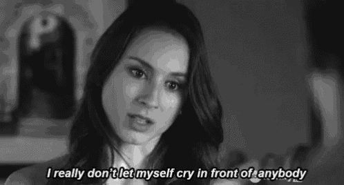a black and white photo of a woman with the words i really don t let myself cry in front of anybody