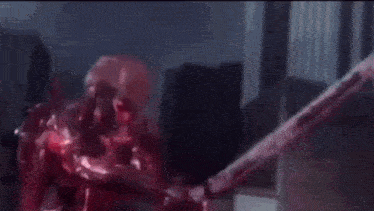 a close up of a person 's face with a red background and the words `` to jack off '' .