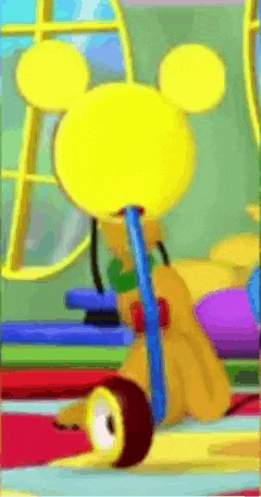 a cartoon of mickey mouse riding a tricycle with a yellow head