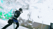 a person is skiing down a snow covered slope while wearing a helmet .