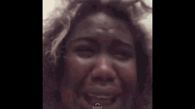 a close up of a woman 's face with her eyes closed .