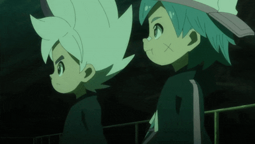 two anime characters are standing next to each other and one has a x on his forehead