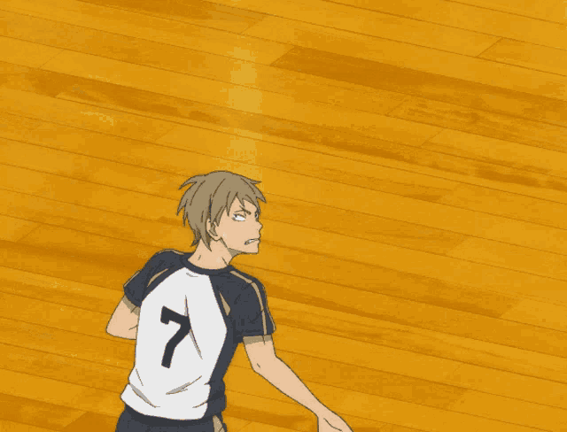 a volleyball player with the number 7 on the back of his jersey