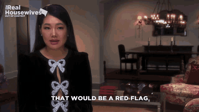 a woman says that would be a red flag while standing in a living room