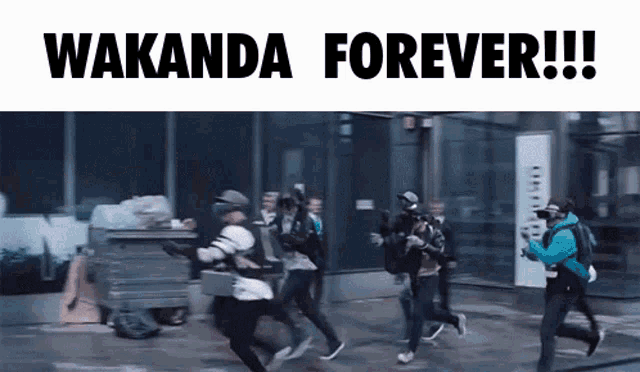 a group of people running down a street with the words wakanda forever written on the bottom